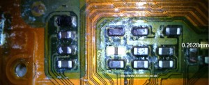 This picture show damage to the circuits that control the phone's screen and touch sensitivity controls.