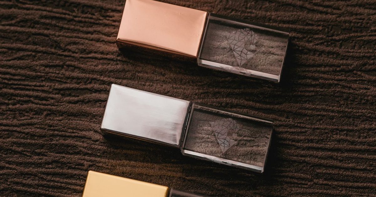 Three USB drives side by side — comparing free data recovery software
